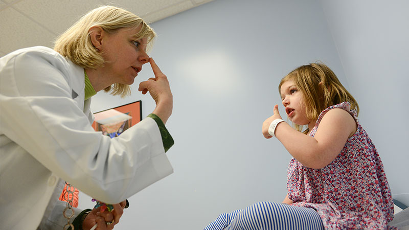 doctor and girl in exam room