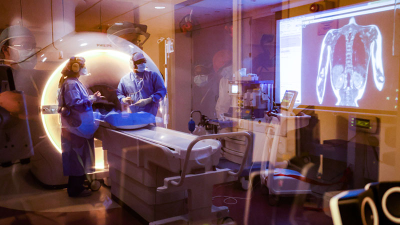 Two health providers looking at MRI scan